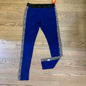Nike women’s deep purpleish blue Leggings with Black Pattern. NWT